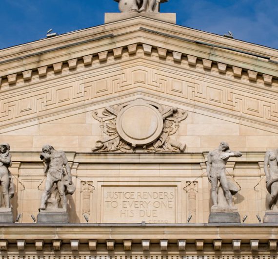 A close-up view of the Essex County Courthouse in Newark, New Jersey.  Designed by Cass Gilbert and constructed in 1907, the marble Beaux-Arts courthouse is listed on the National Register of Historic Places.  The courthouse was rededicated in 2004 after a $50 million restoration led by Farewell Mills Gatsch Architects.